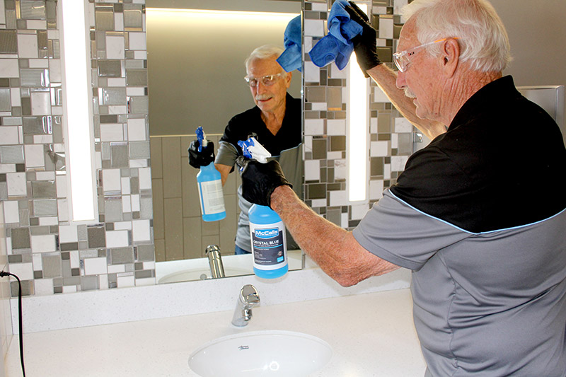 Man Cleaning Bathroom